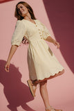 Woman wearing a white dress against a pink background