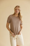 Woman wearing a brown shirt