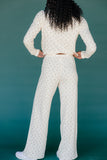 Person wearing a white textured outfit against a teal background