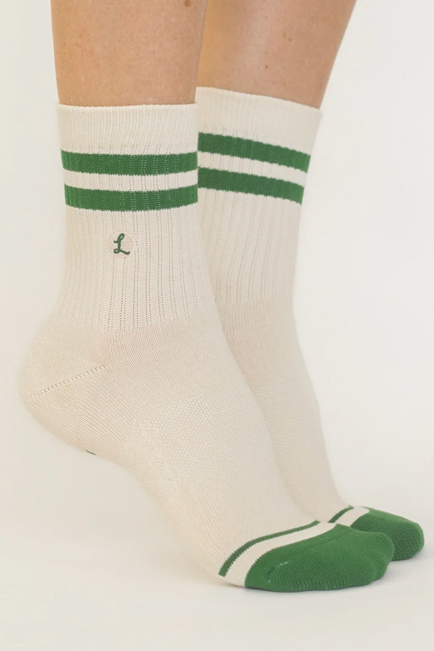 a pair of socks with green stripes