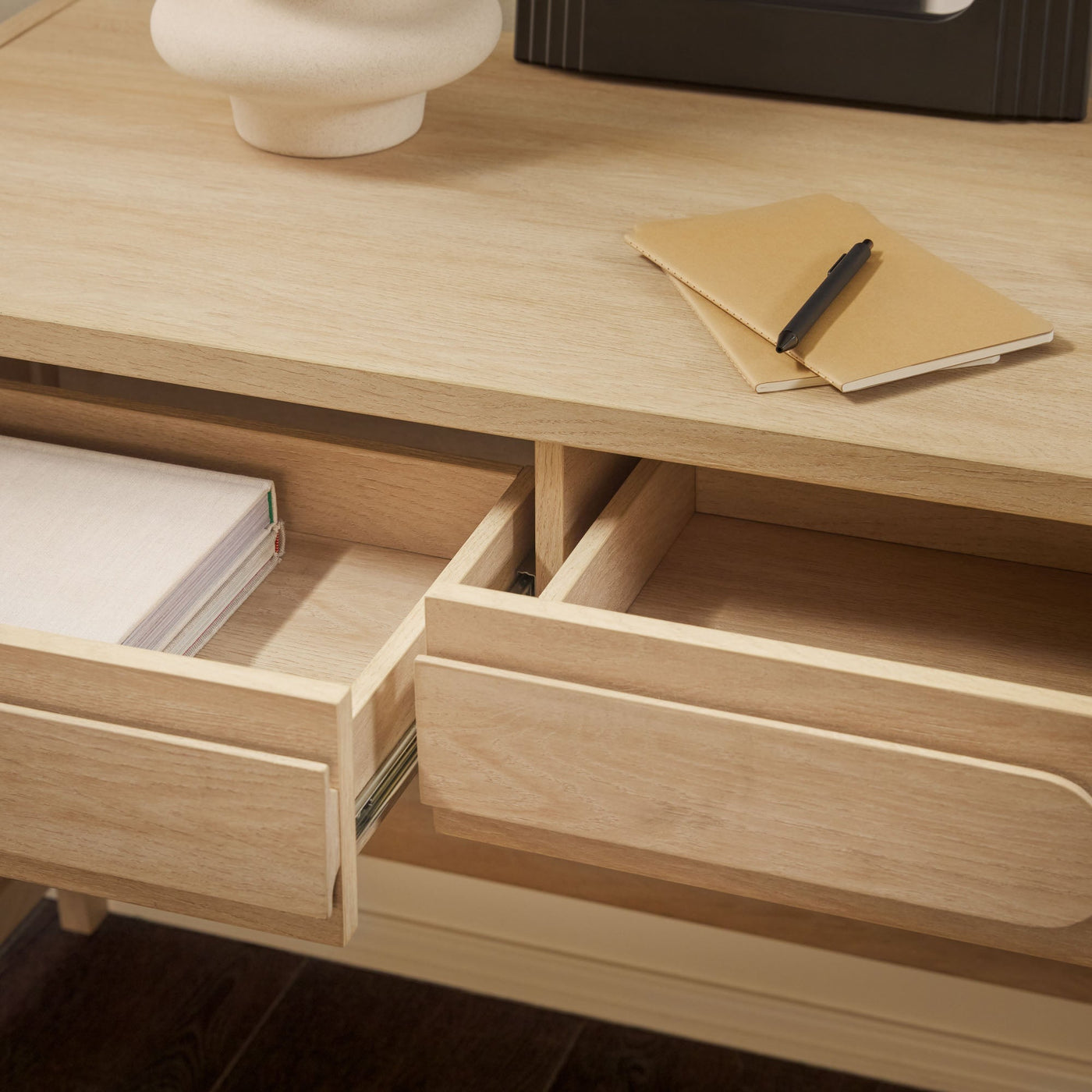 a desk with a couple of drawers