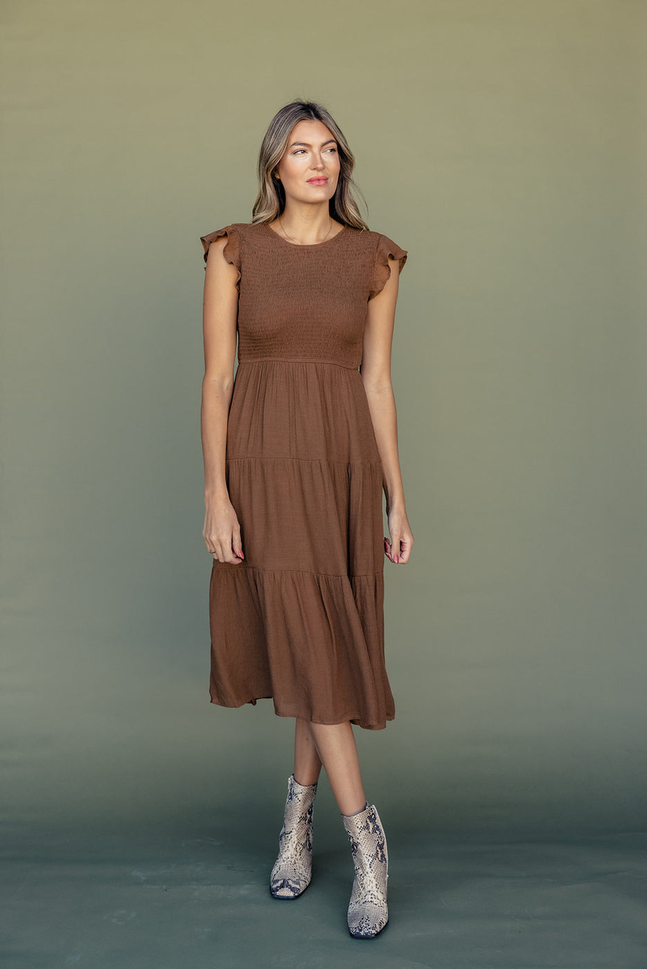 a woman in a brown dress