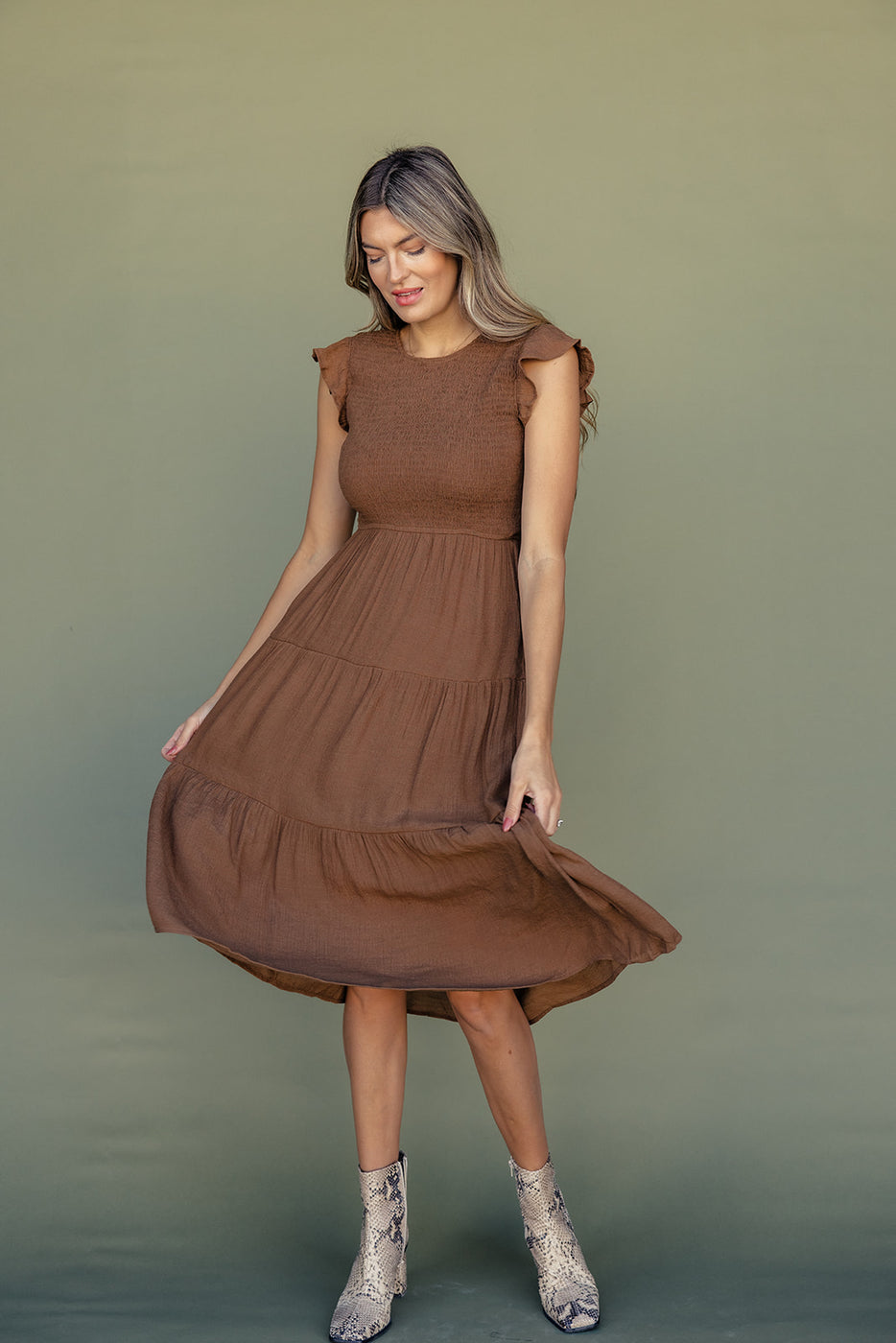 a woman in a brown dress