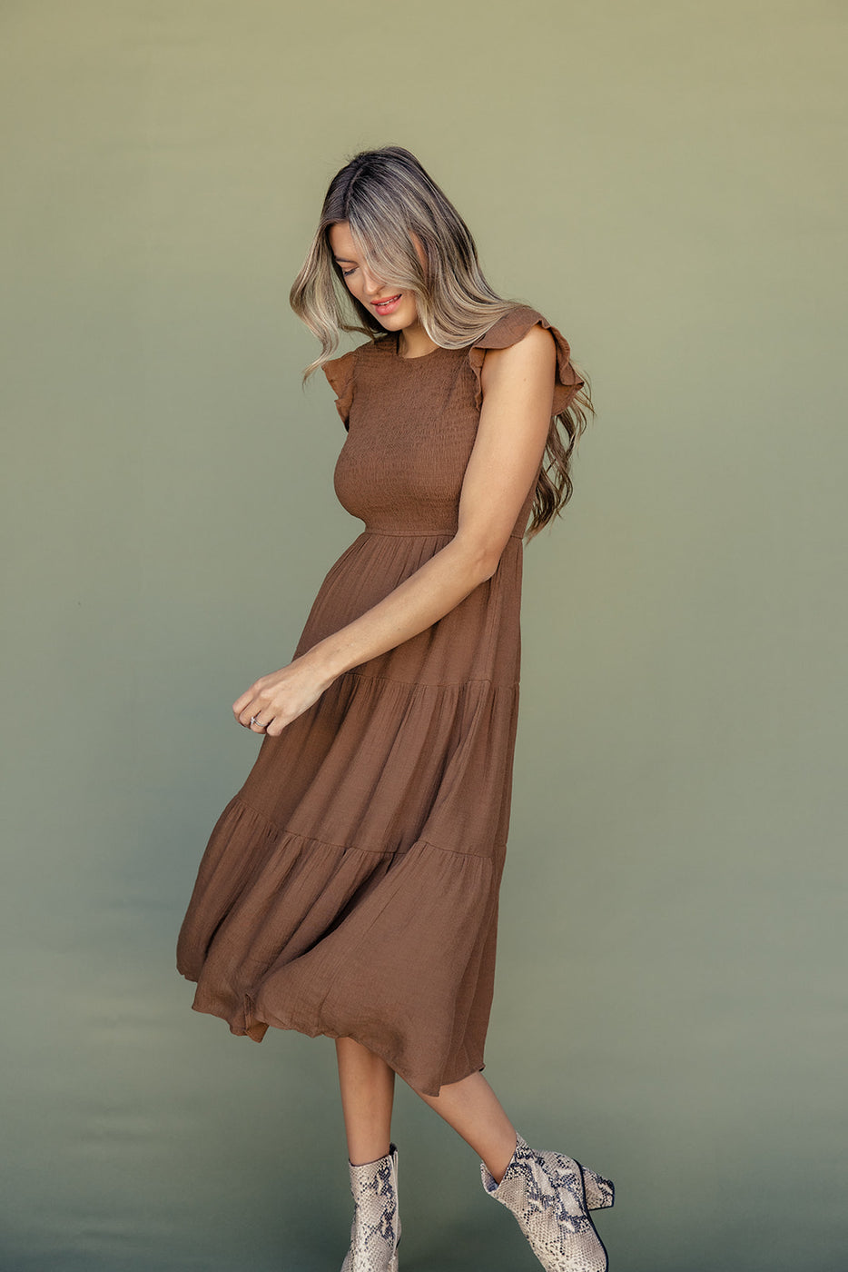 a woman in a brown dress