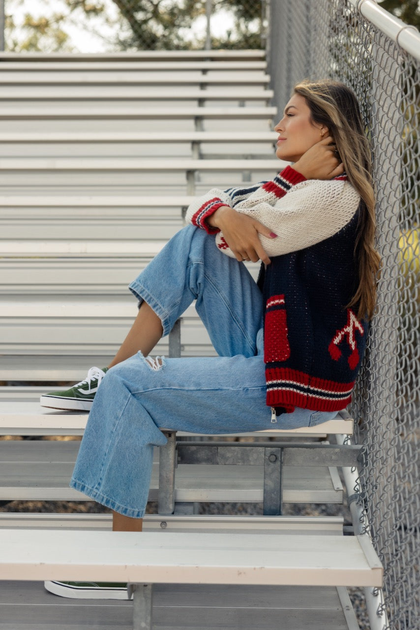 a woman sitting on a bench