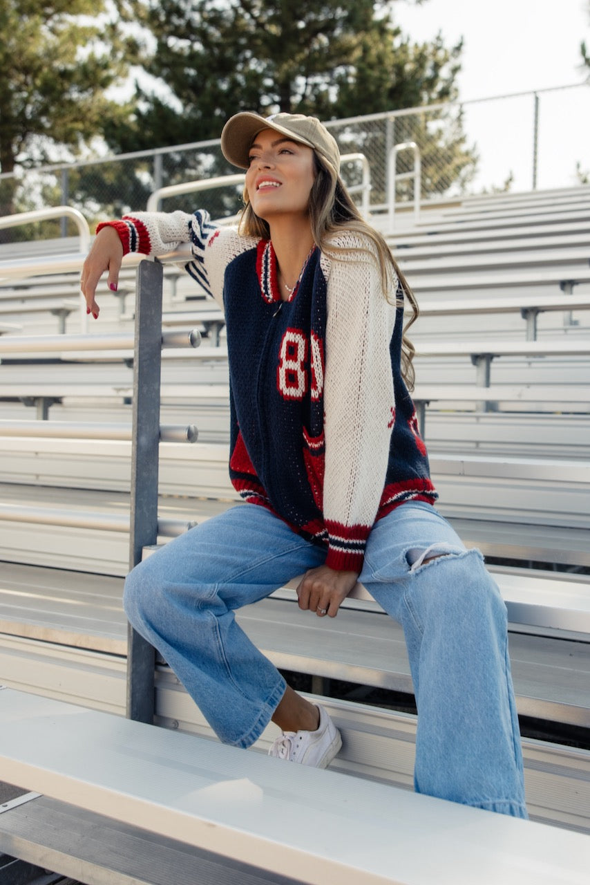 a woman sitting on a bench