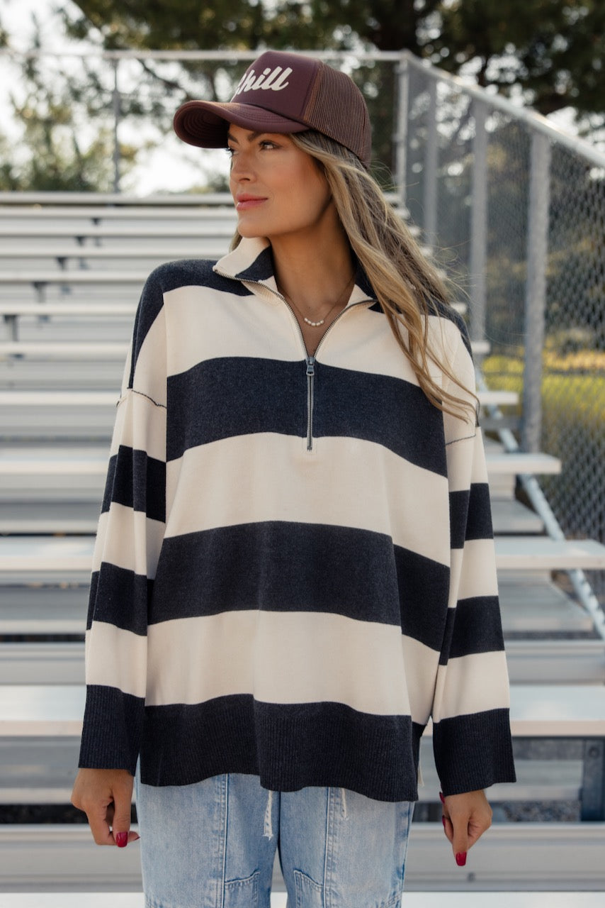 a woman in a striped shirt