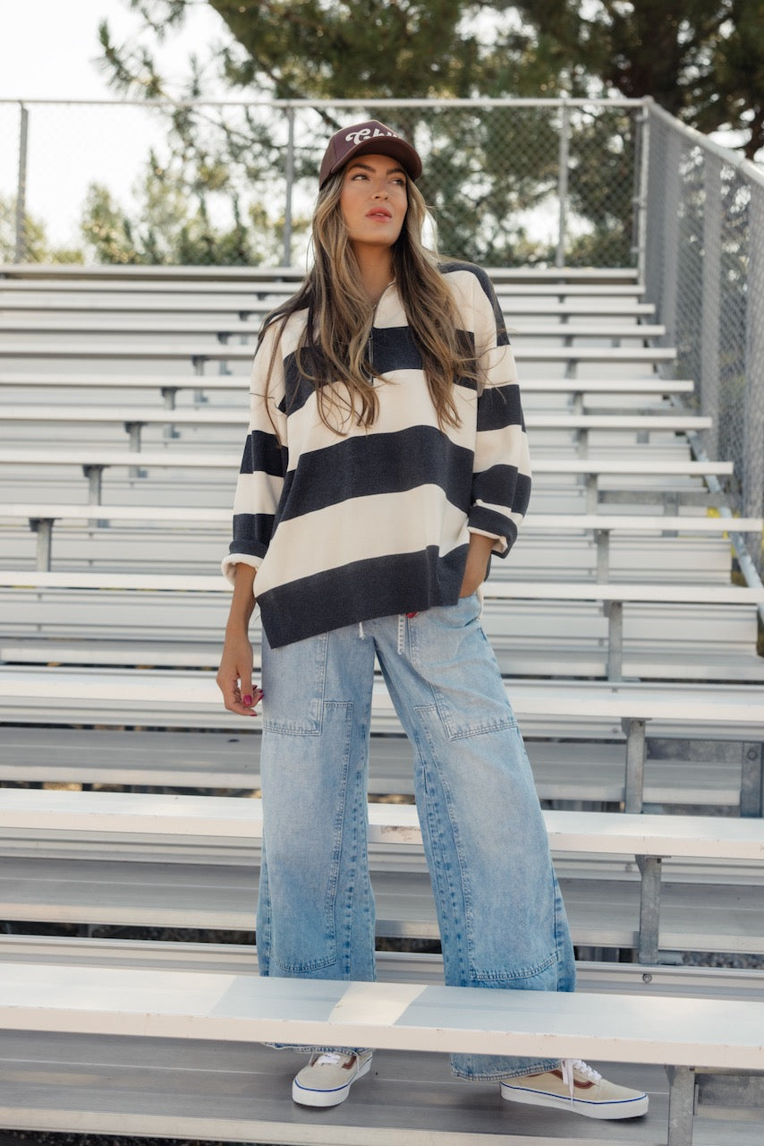 a woman standing in a stadium