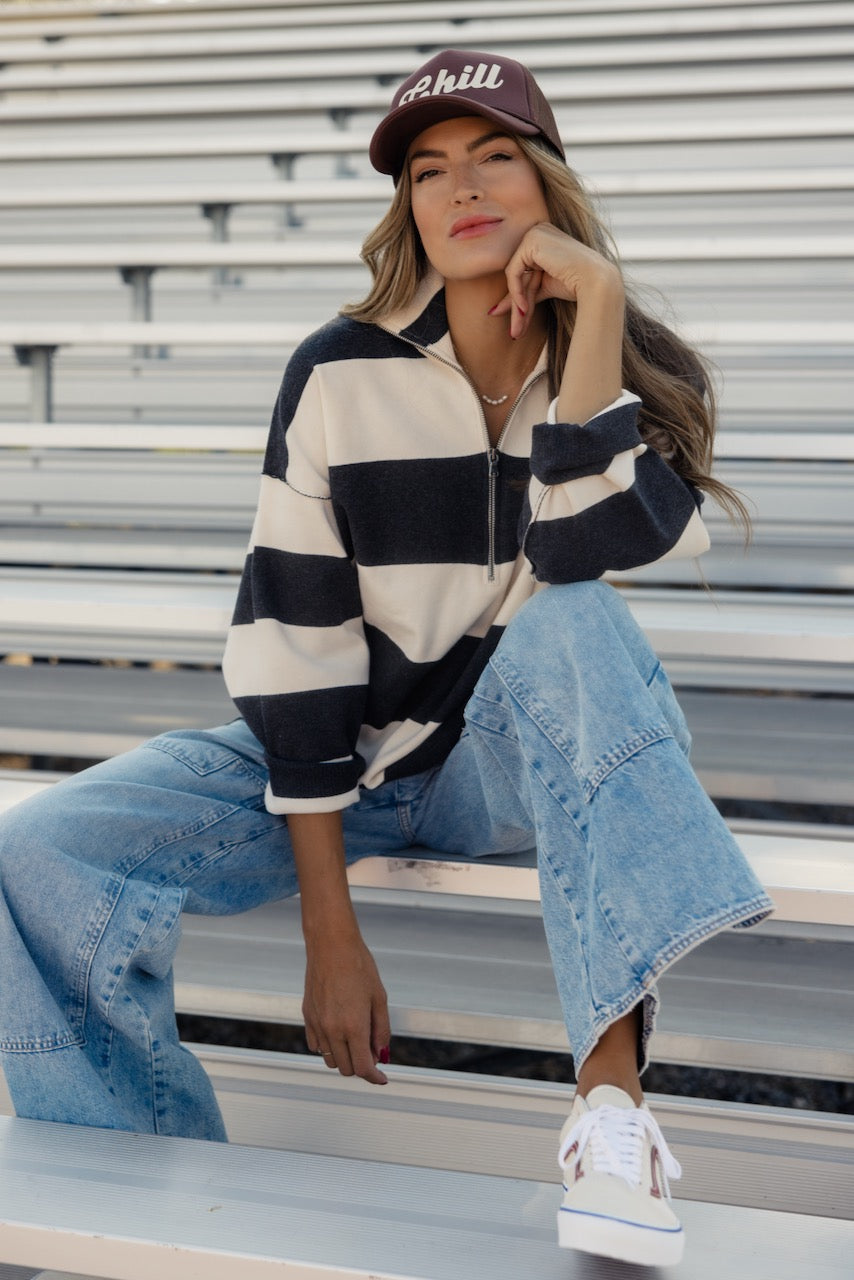 a woman sitting on a bench