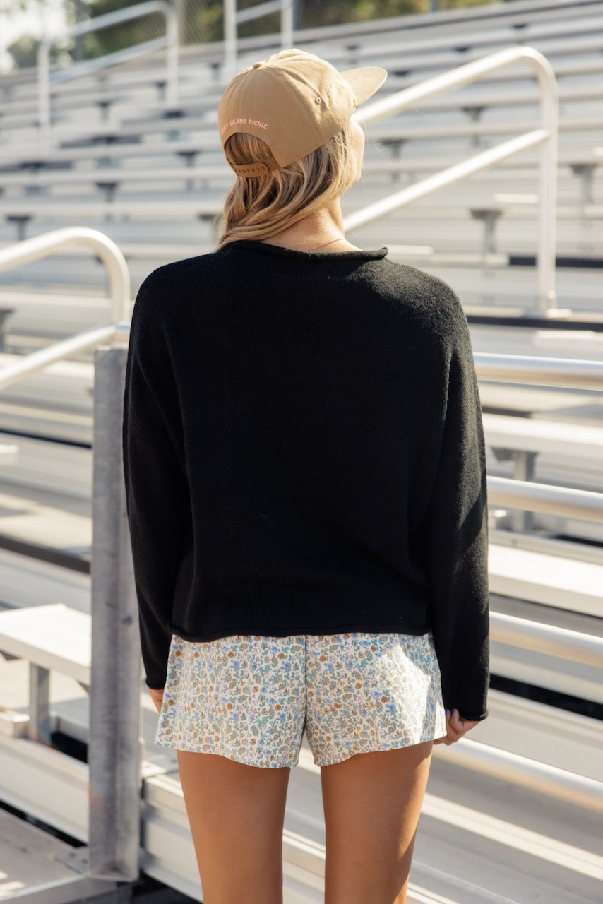 a woman standing in a bleachers