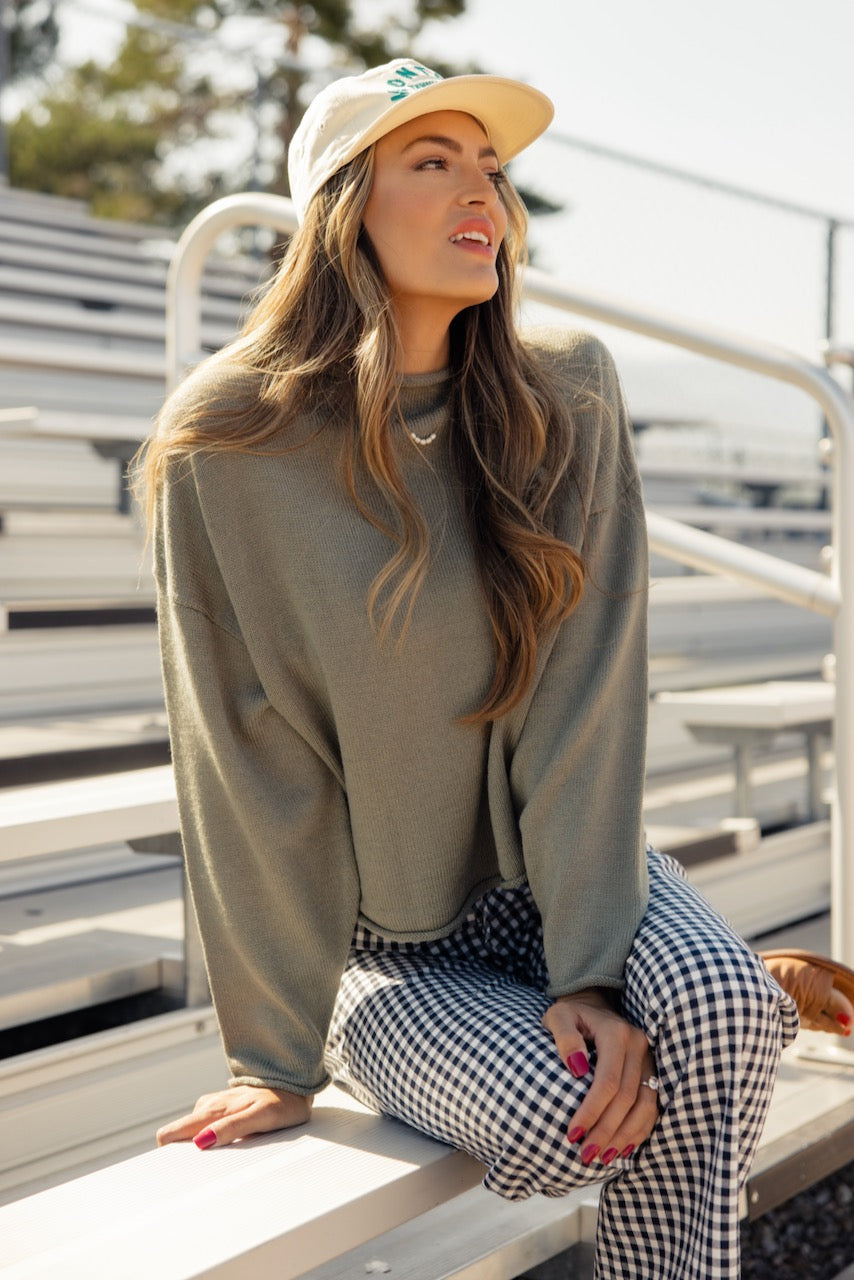 a woman sitting on a bench