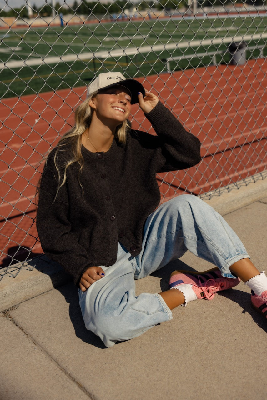 a woman sitting on the ground