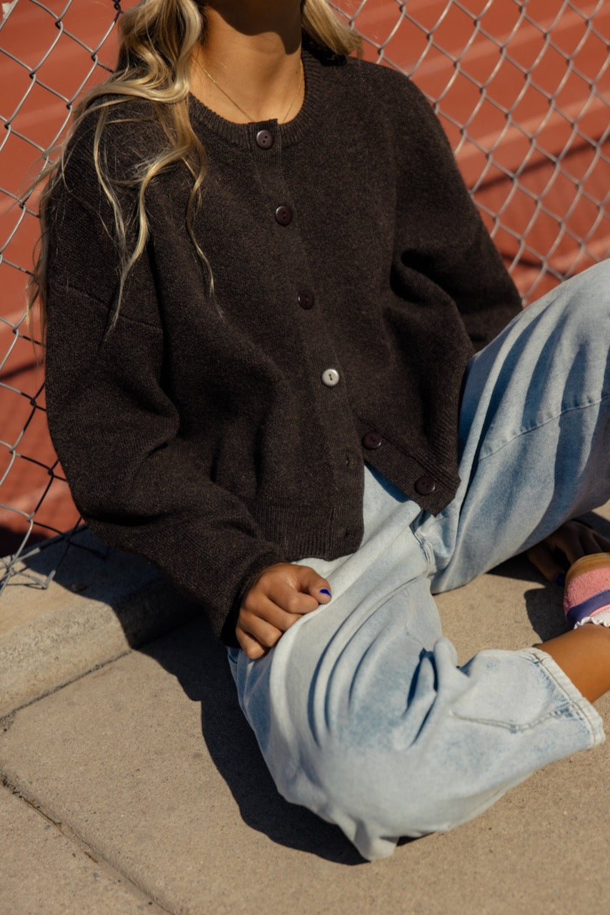 a woman sitting on the ground