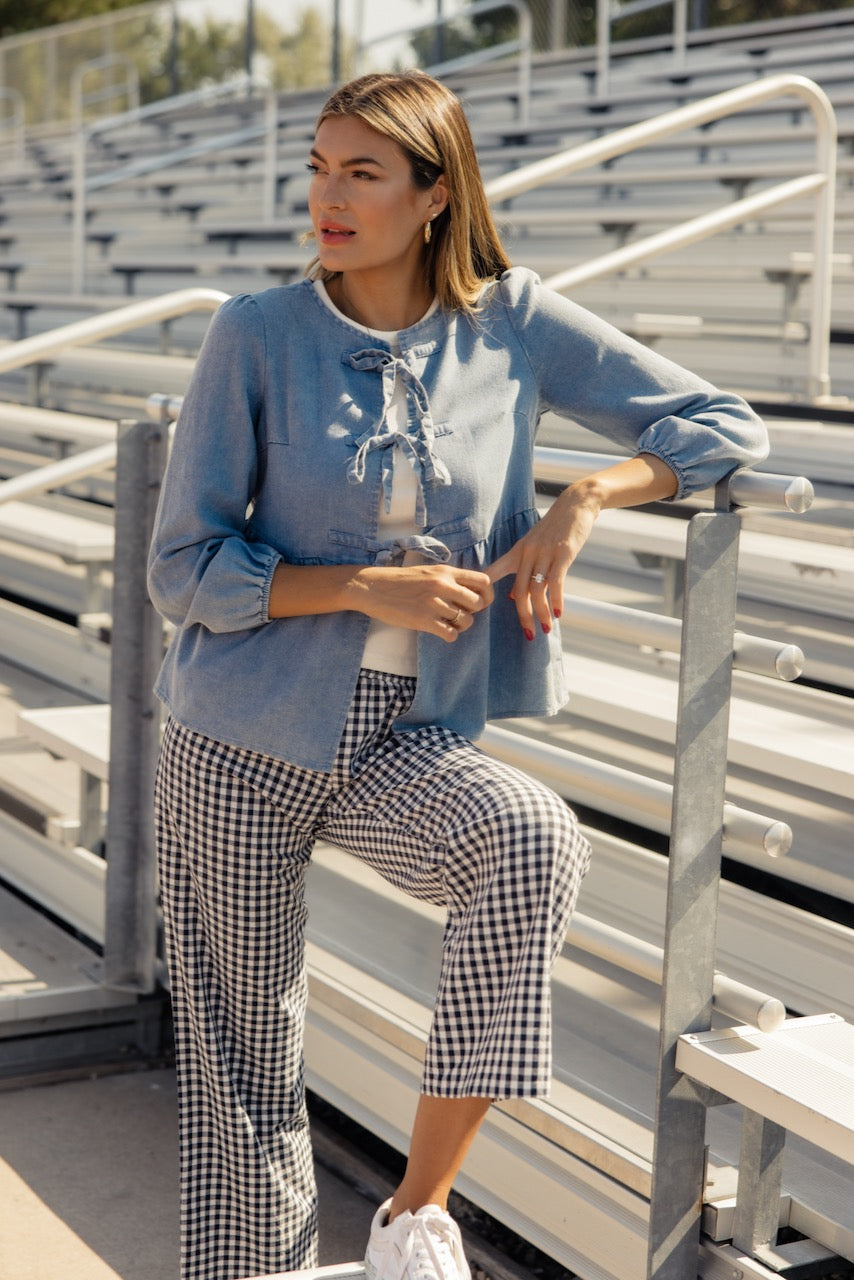 a woman leaning on a railing