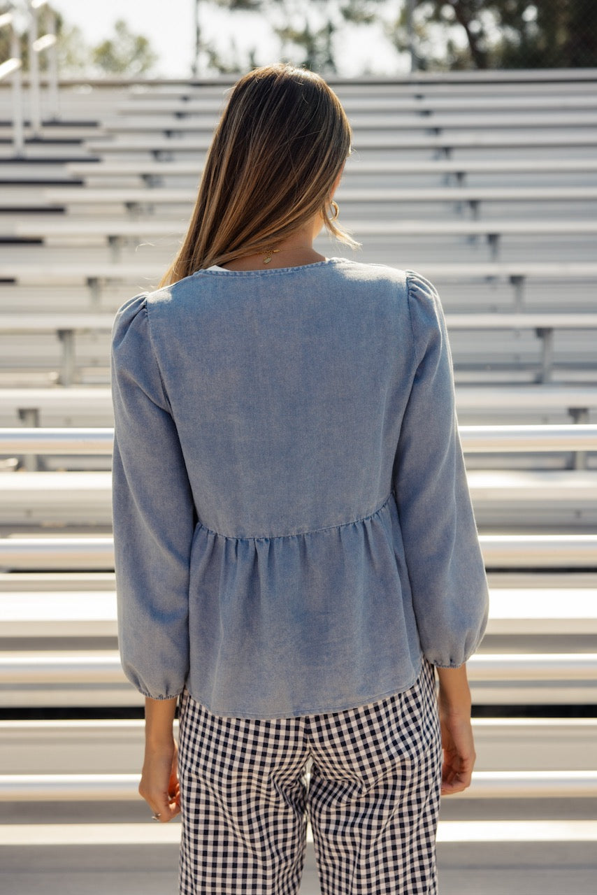 a woman standing in a stadium