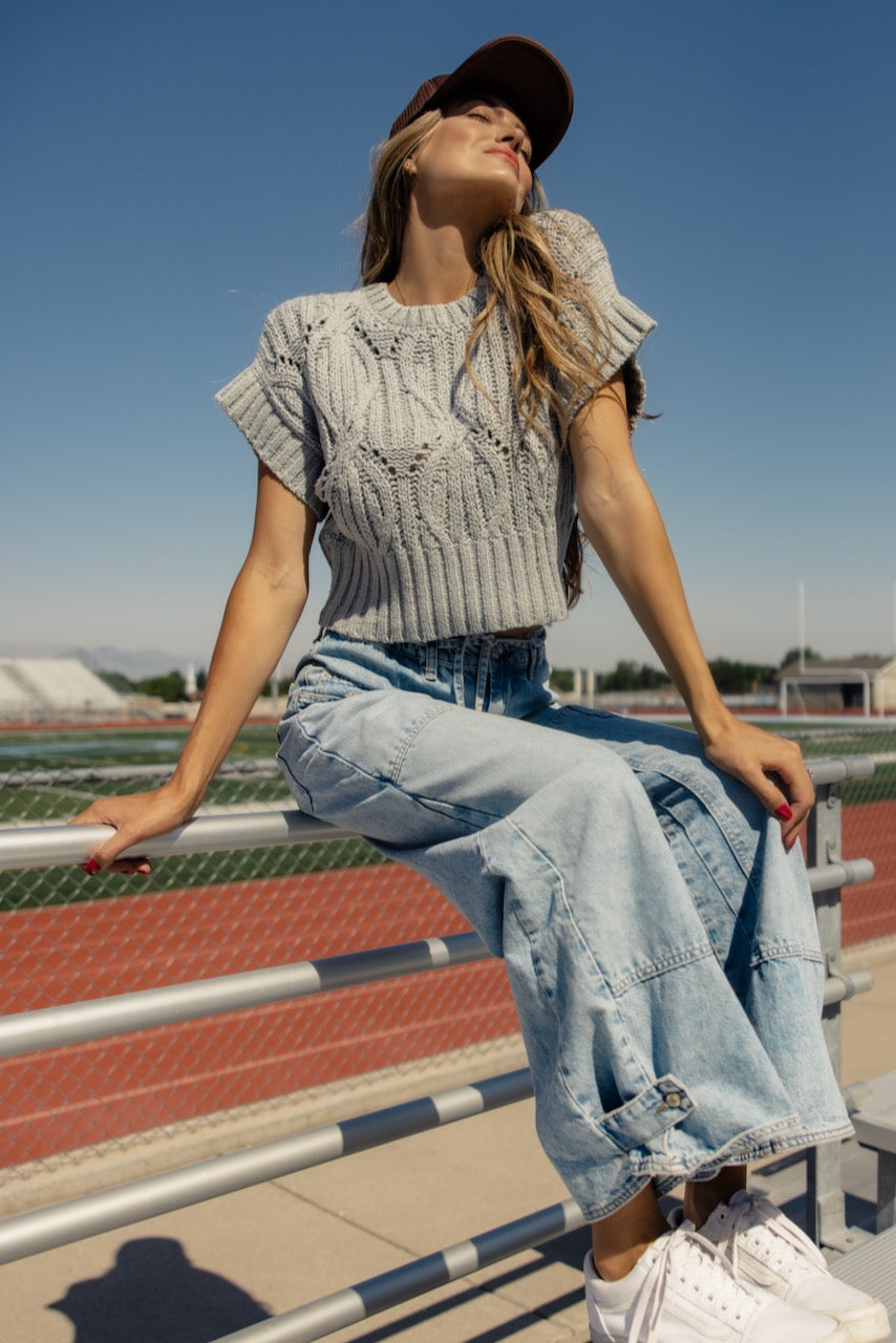 a woman sitting on a railing