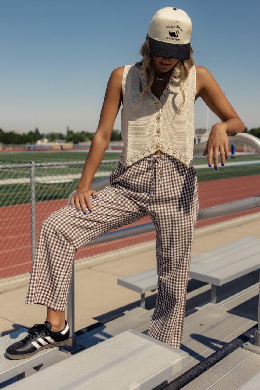 a woman leaning on a metal railing