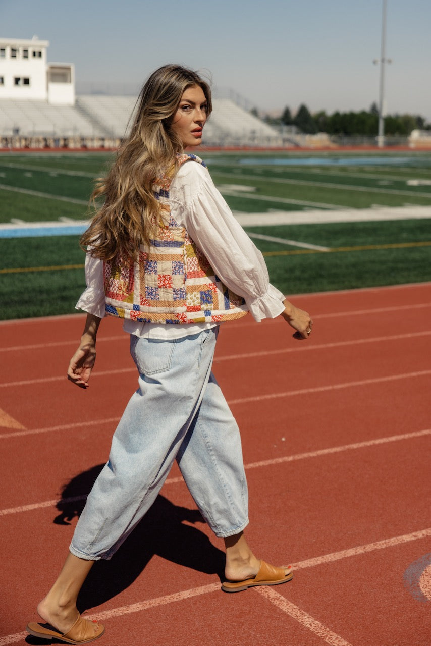 a woman walking on a track