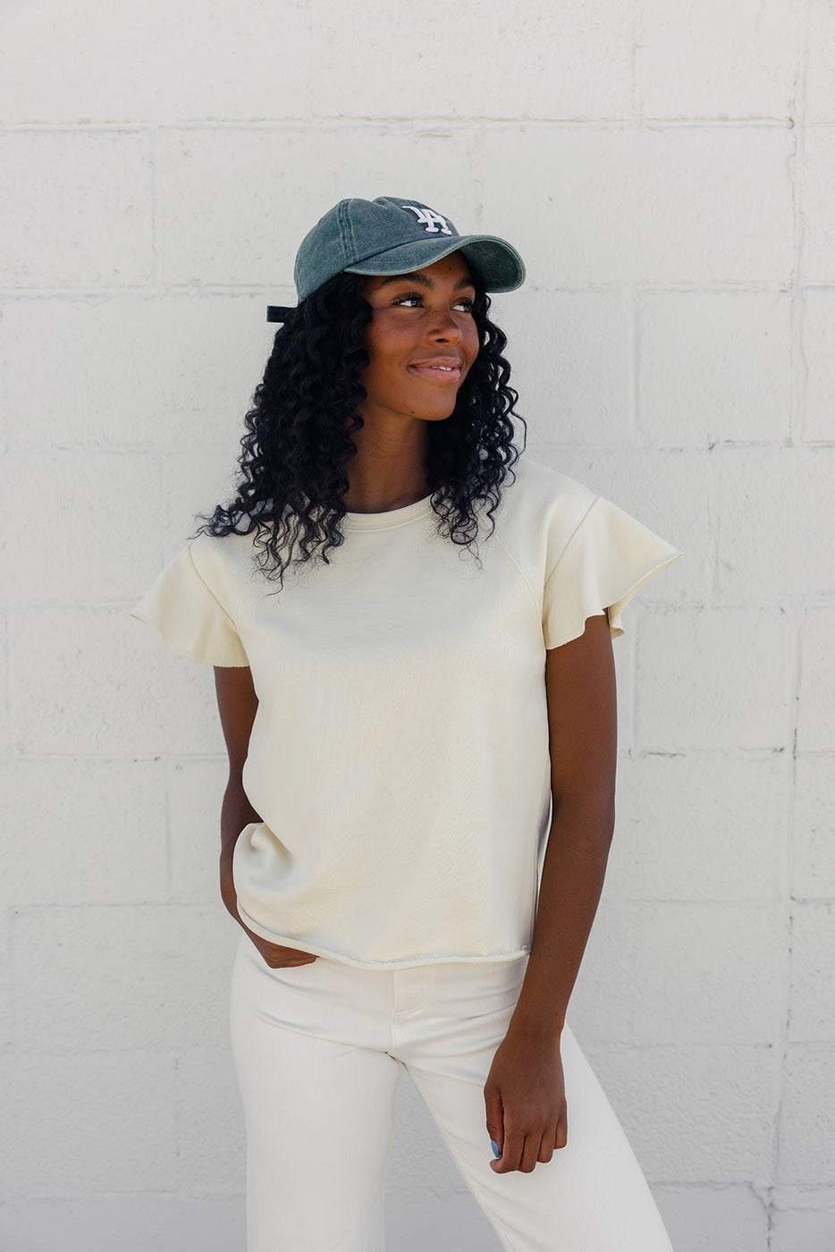 a woman wearing a baseball cap