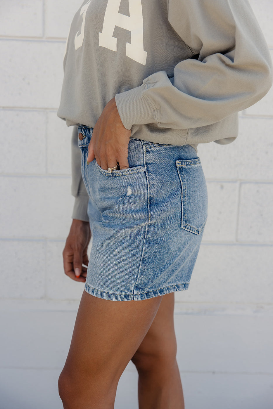 a person wearing a jean skirt