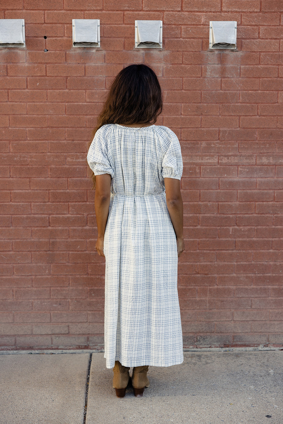 a woman in a long white dress