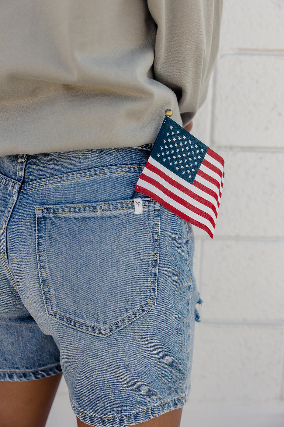 a person with a flag in their pocket
