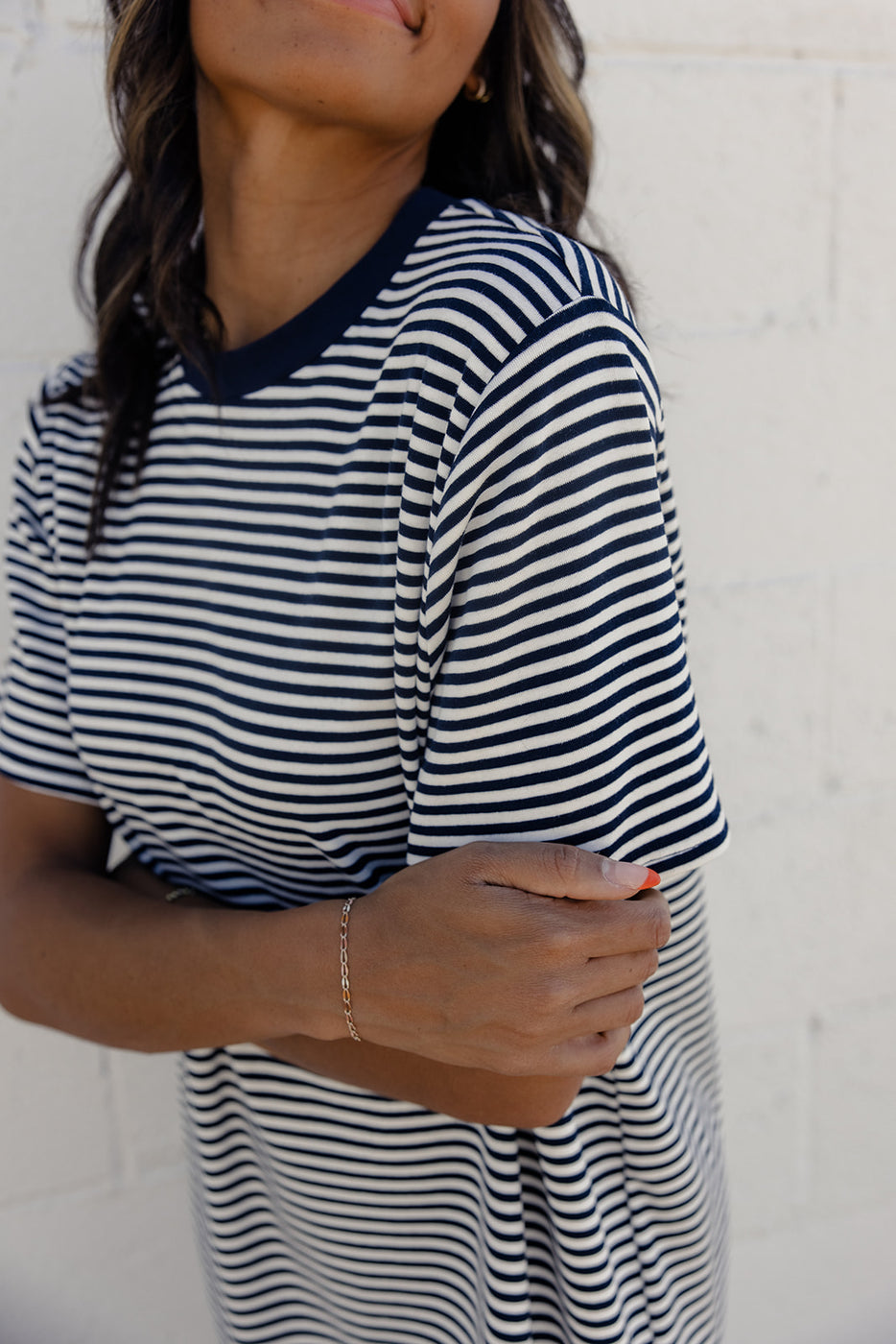 a woman wearing a striped shirt