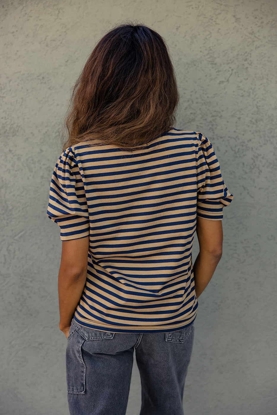 a woman in a striped shirt