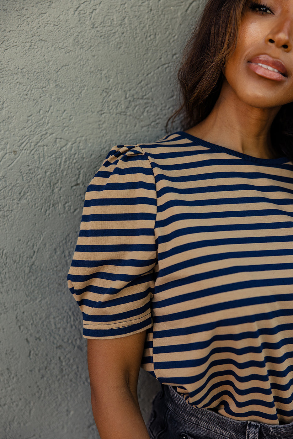 a woman wearing a striped shirt