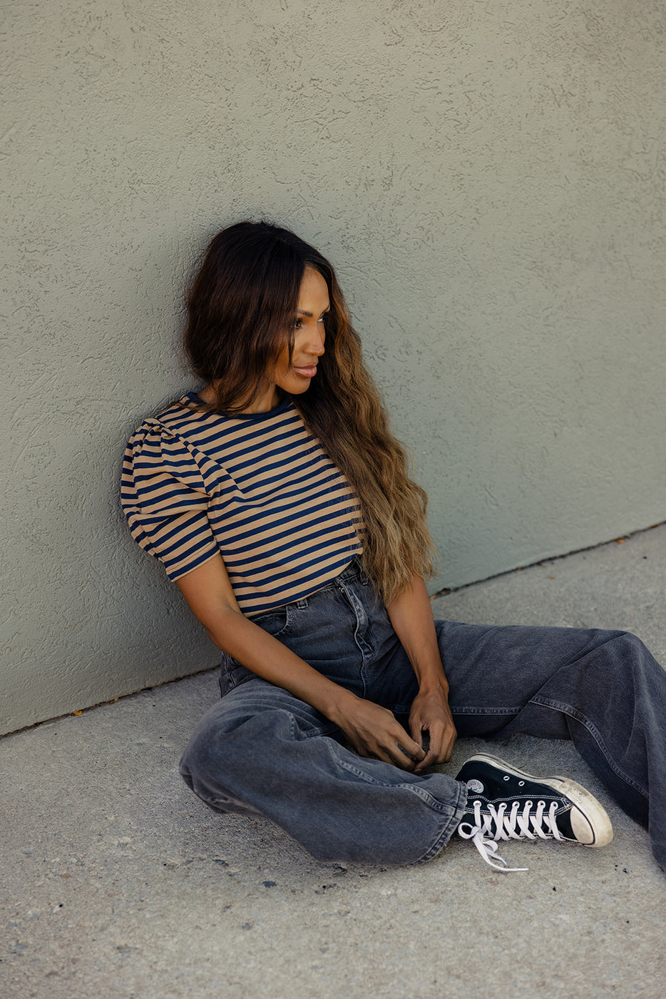 a woman sitting on the ground