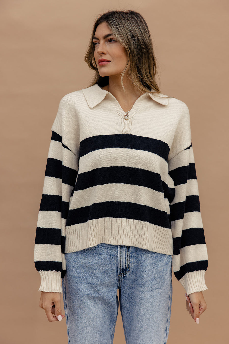 a woman in a striped sweater