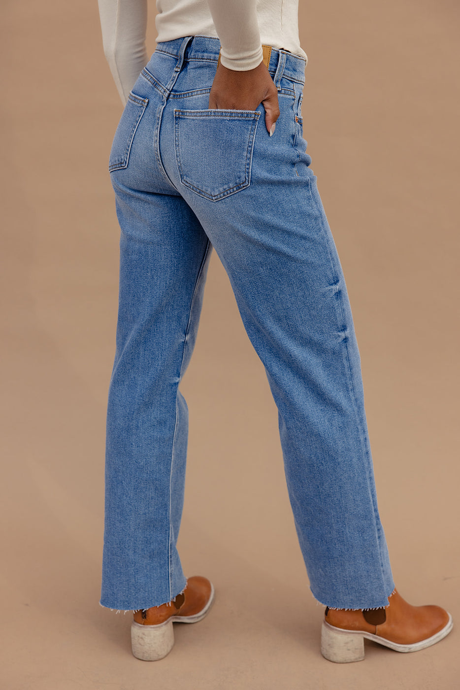 a person wearing blue jeans