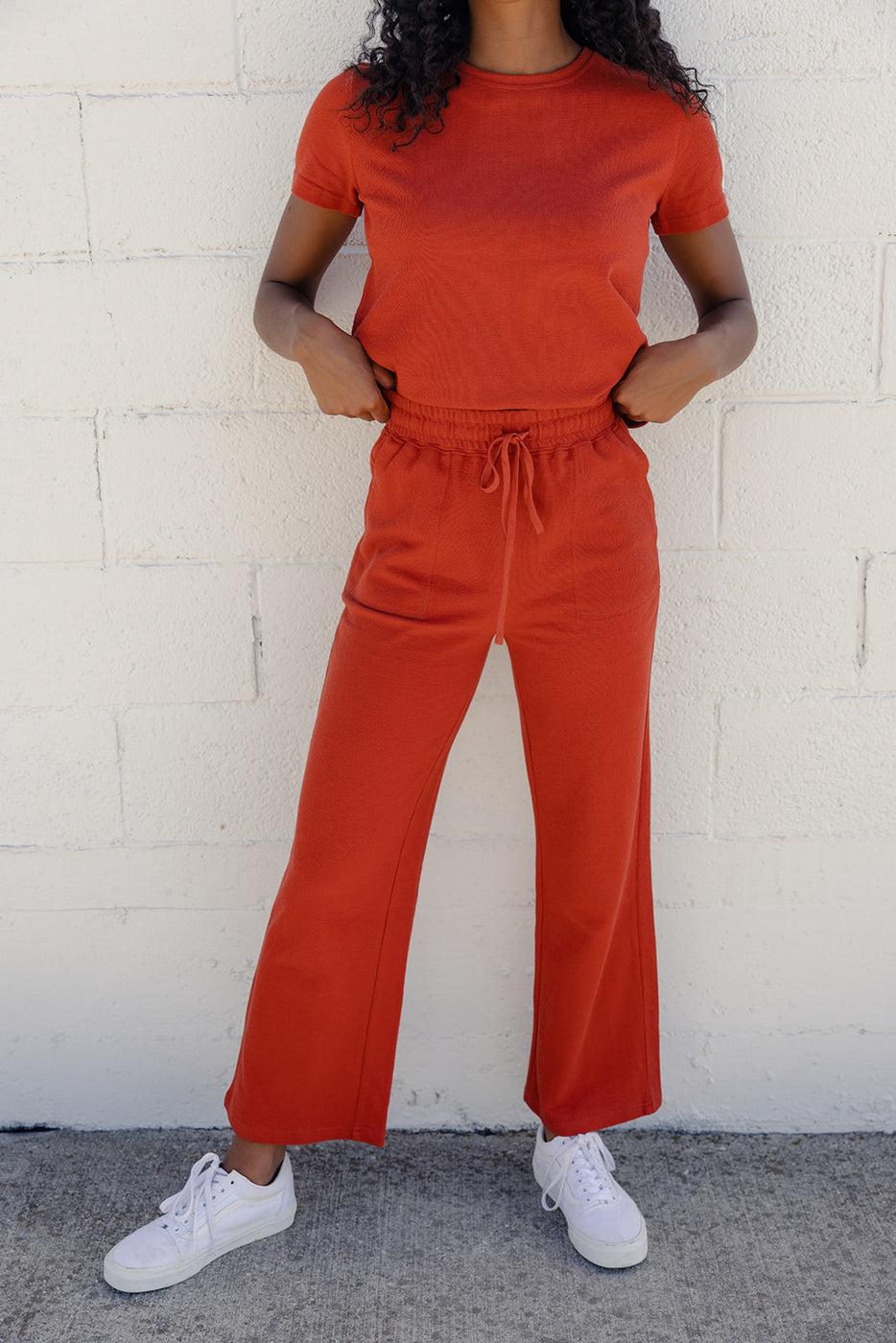 a woman in red pants and a shirt