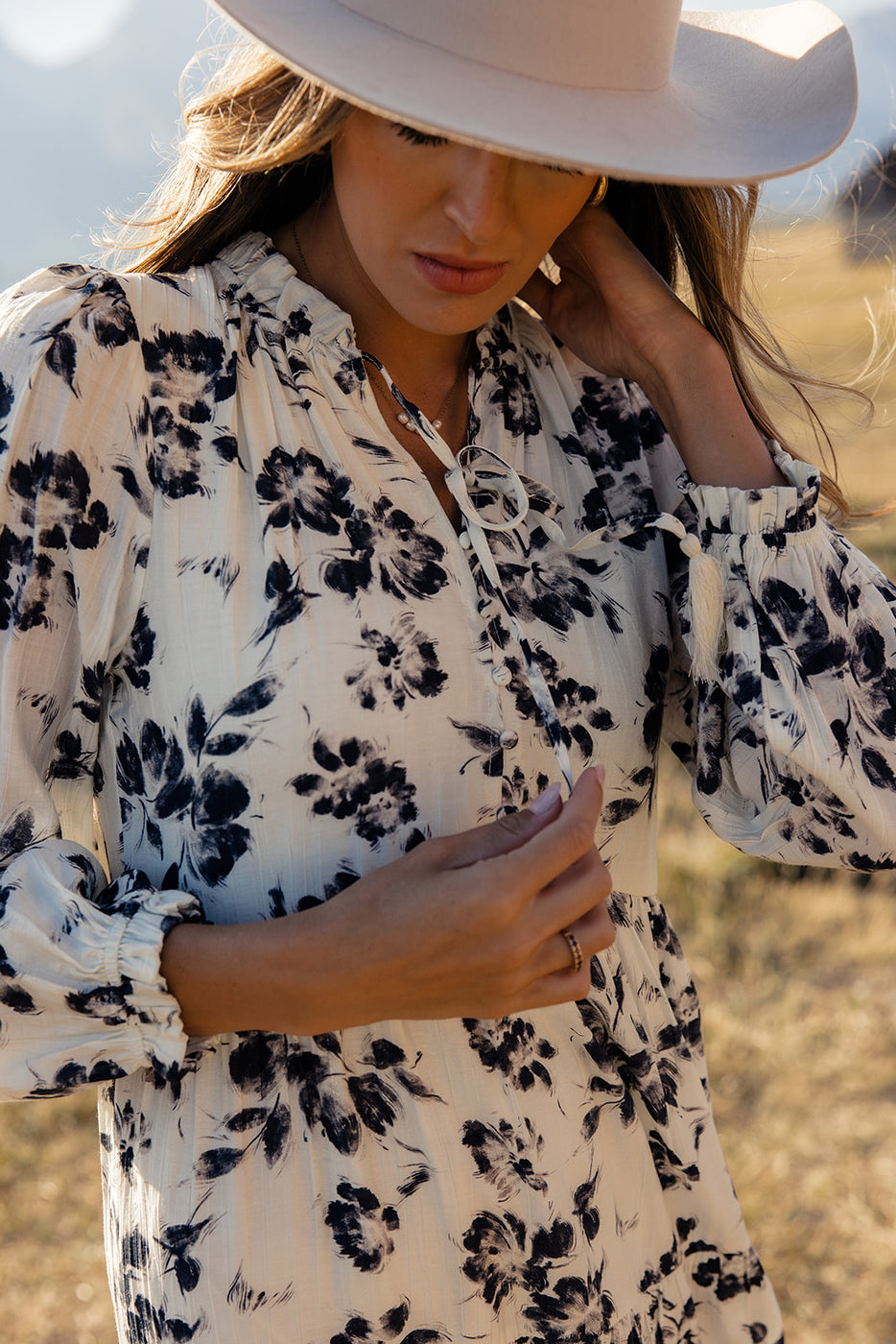 a woman wearing a floral dress