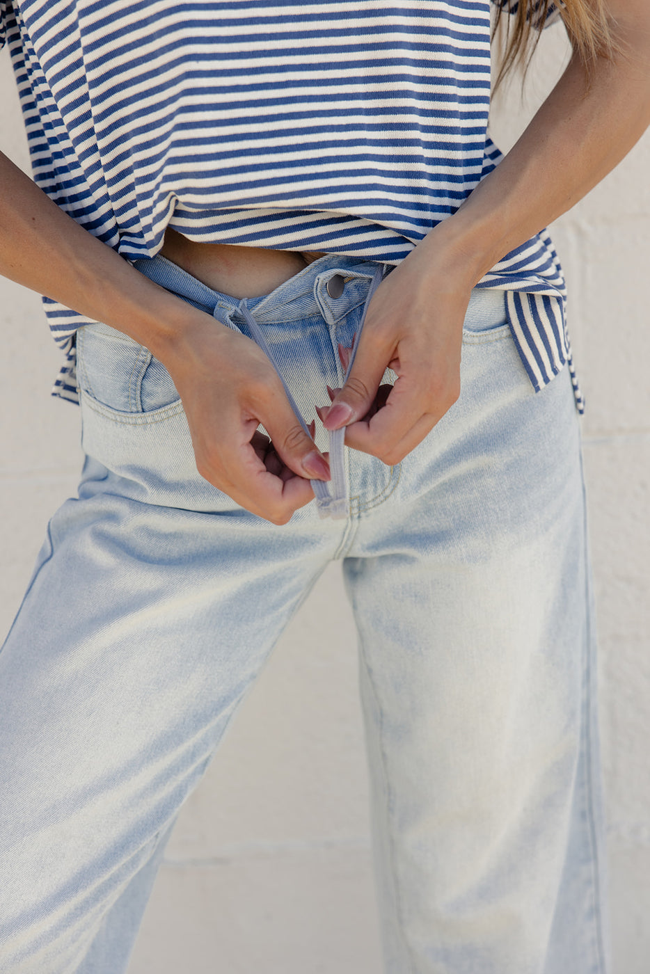a person wearing blue jeans