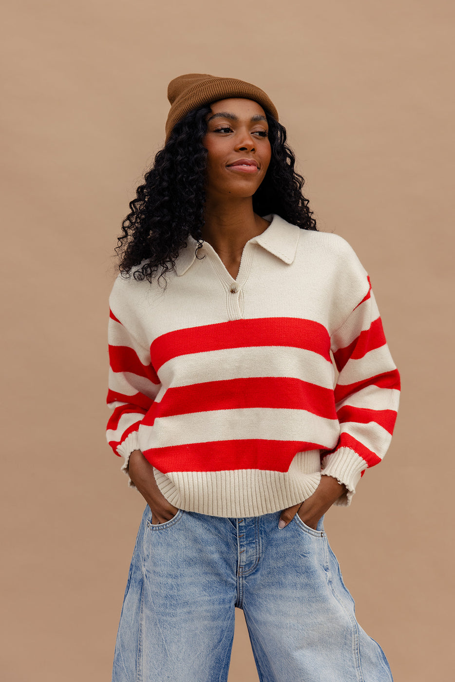 a woman in a red and white striped sweater