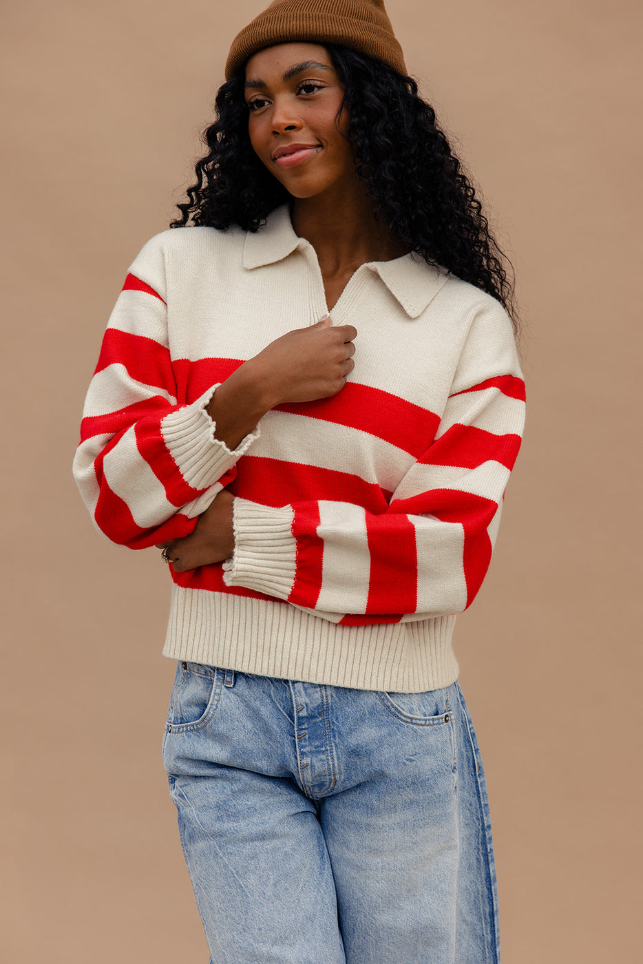 a woman wearing a red and white striped sweater