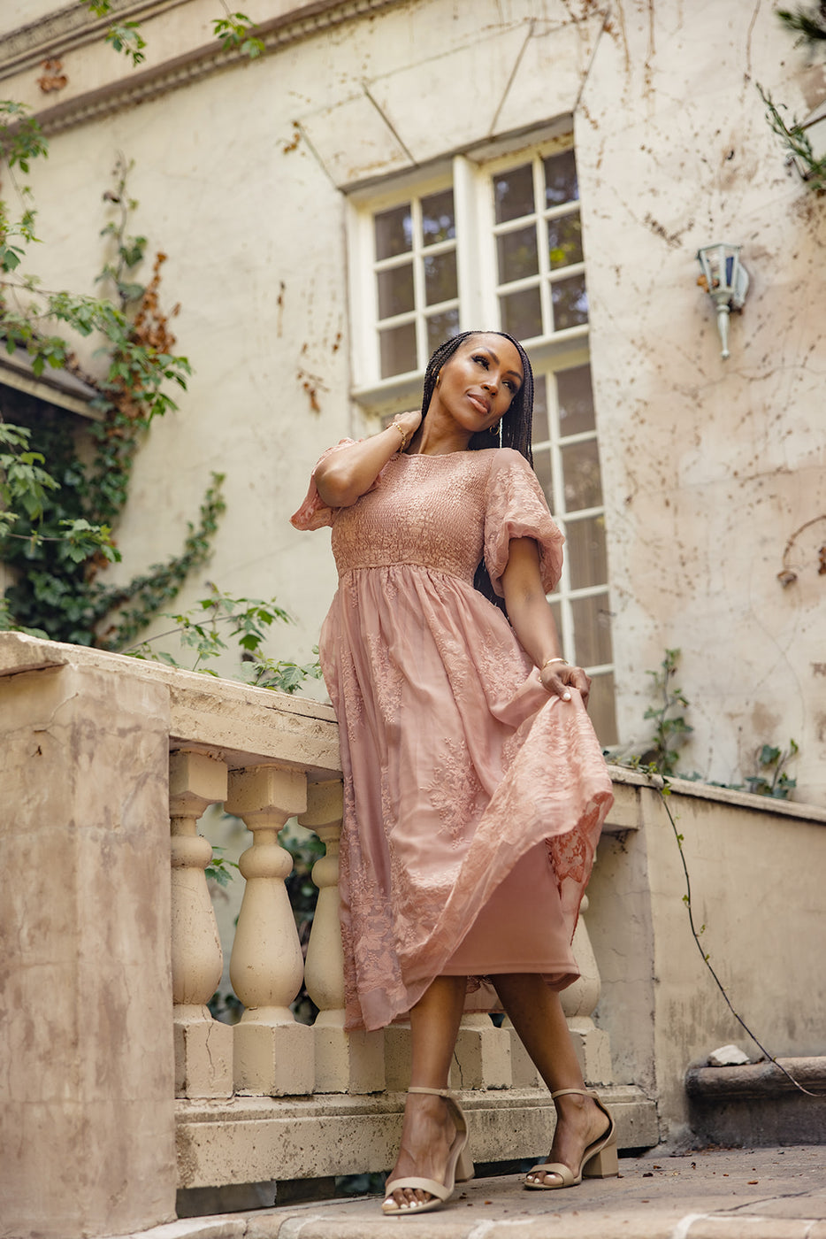 a woman in a pink dress