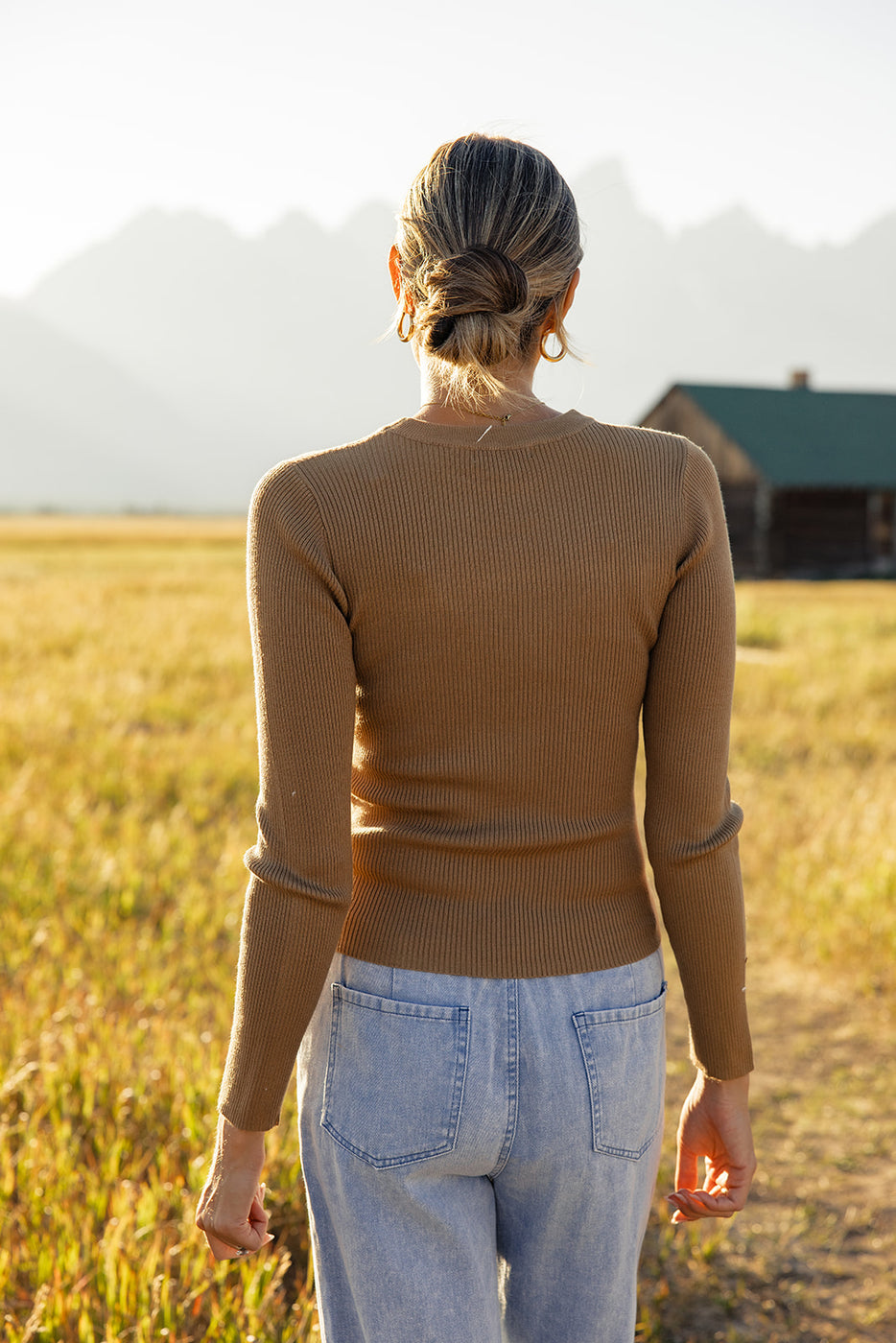 a woman standing in a field