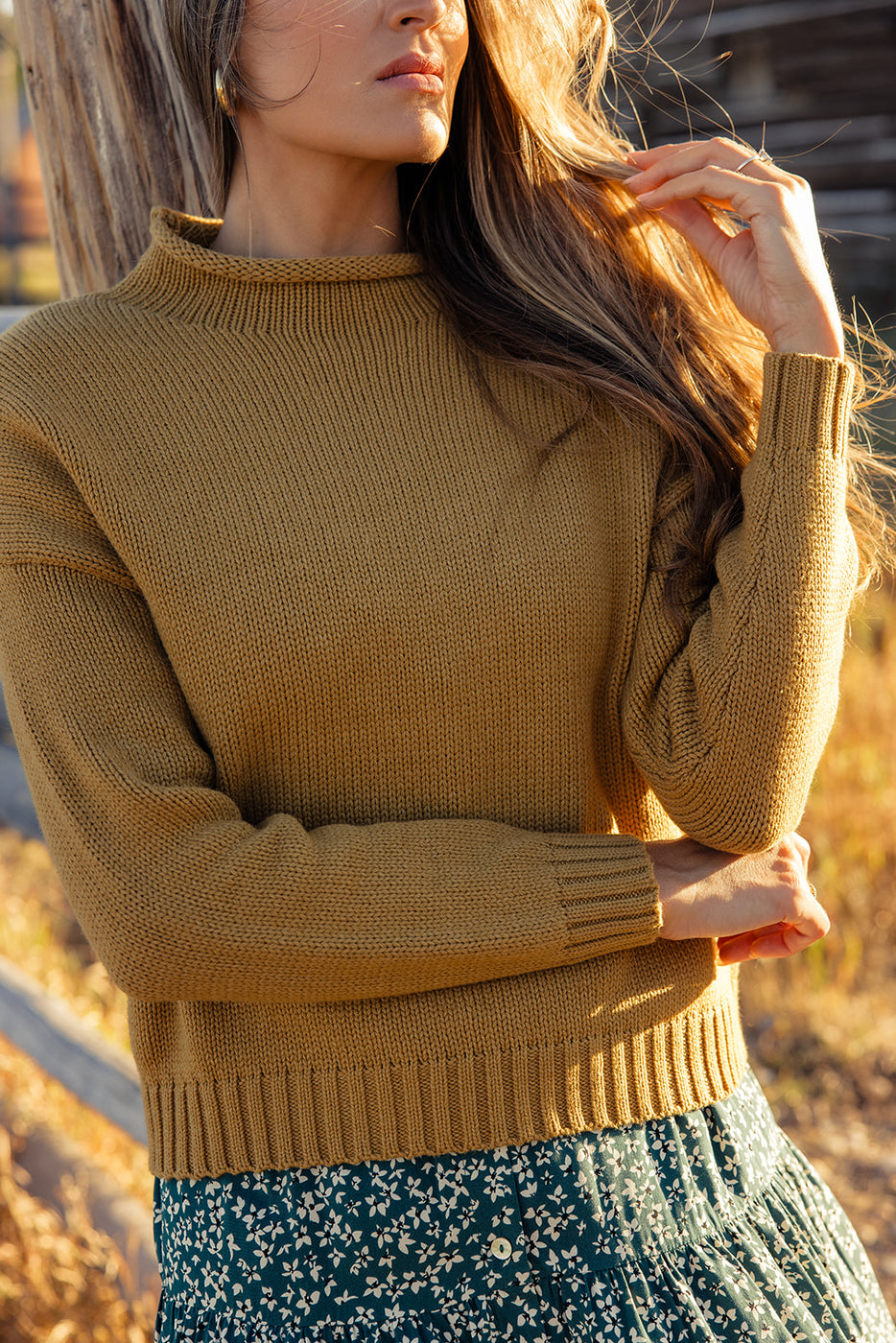 a woman wearing a sweater