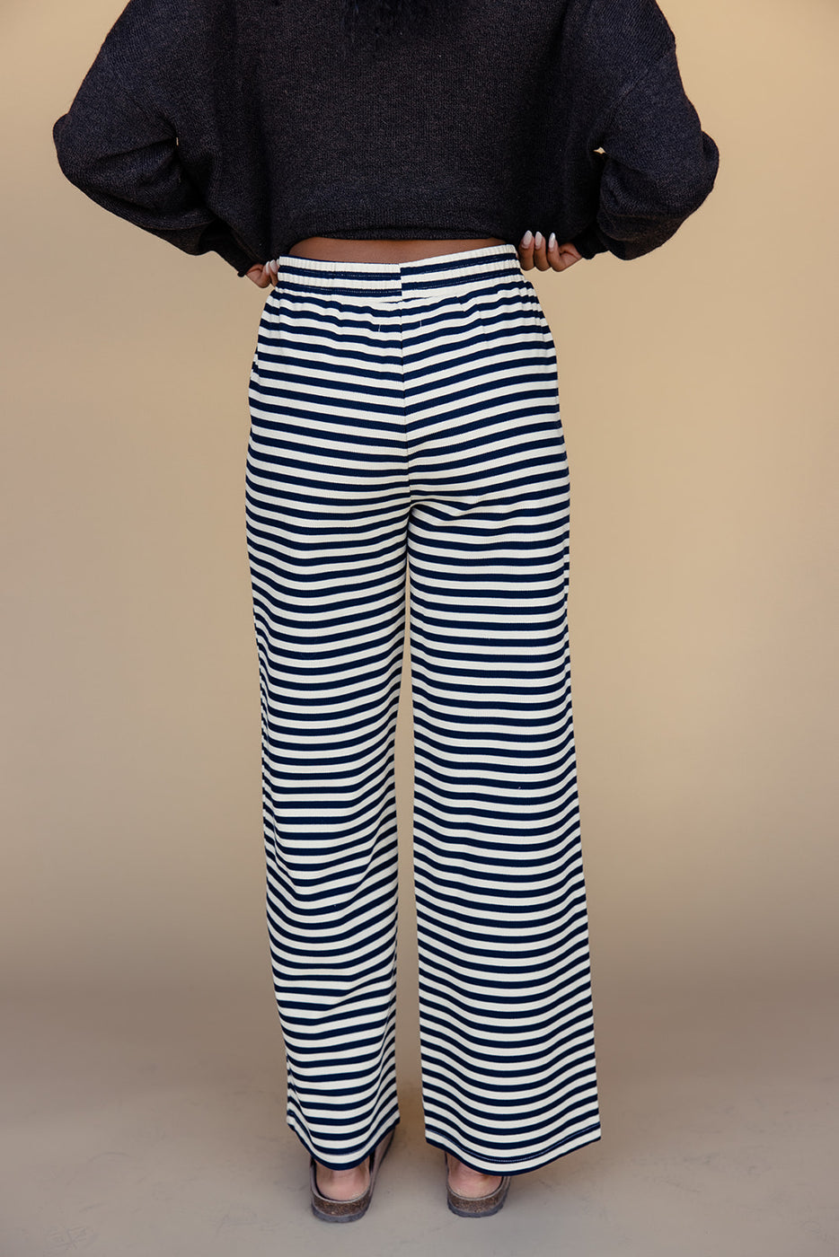 a person wearing striped pants