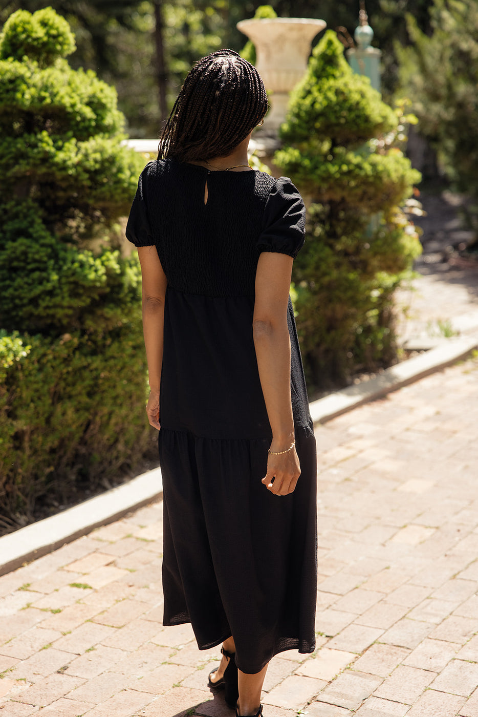 a woman in a black dress