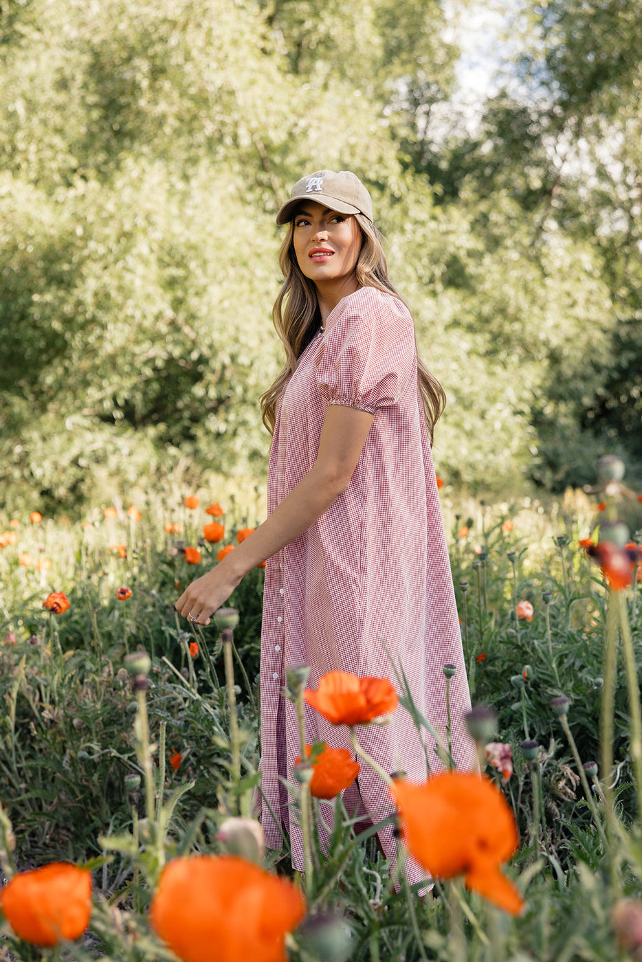 a woman in a field of flowers