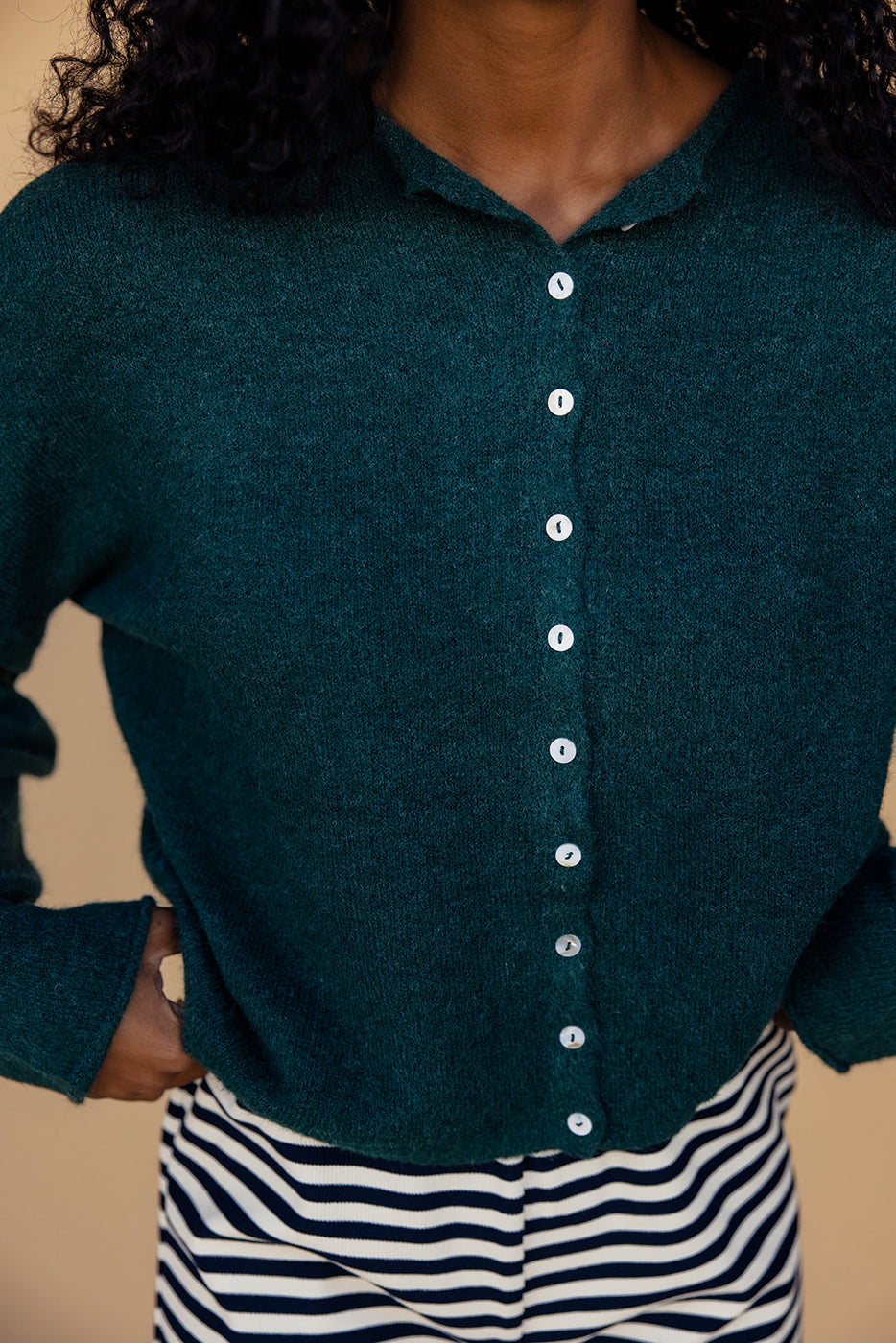 a person wearing a green sweater