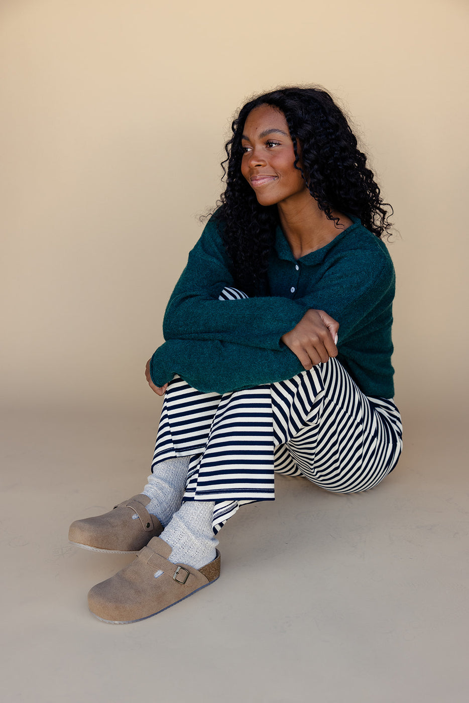 a woman sitting on the floor