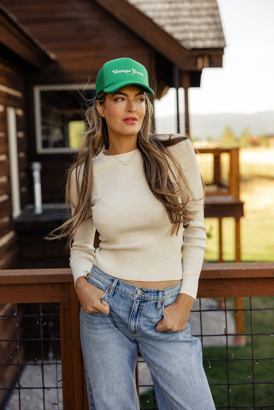 a woman wearing a green hat