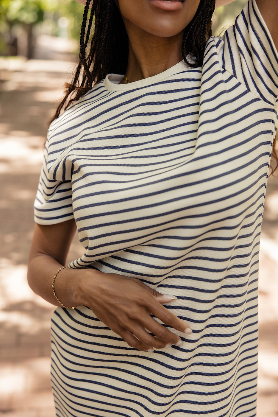 a woman wearing a striped shirt