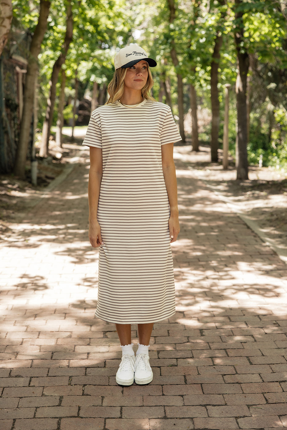 a woman in a striped dress