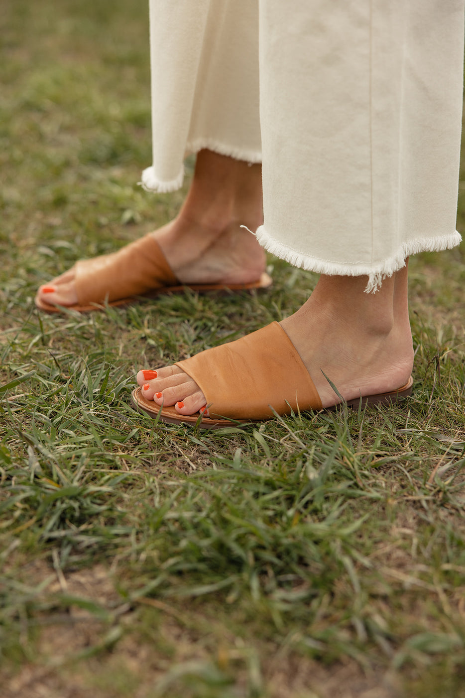 a pair of feet in sandals