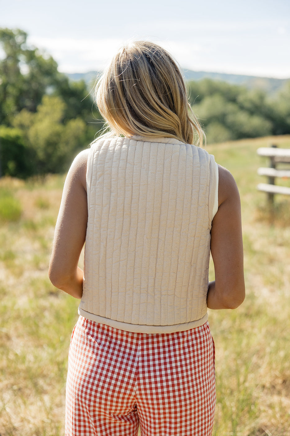 a woman standing in a field